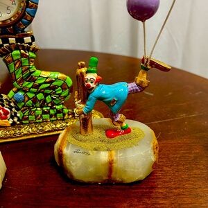 collection of clown figurines by Ron Lee, known for his 24K gold and pewter.